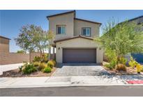 Charming two-story home featuring a well-maintained front yard and a two-car garage at 8254 Palladium St, Las Vegas, NV 89113