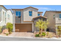 Charming two-story home featuring a well-kept front yard and a two car attached garage at 10776 Maltese Falcon Ave, Las Vegas, NV 89129