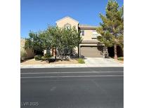 Charming two-story home with a well-manicured lawn and attached two-car garage in a residential neighborhood at 1146 Olivia Pkwy, Henderson, NV 89011