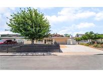 Charming single-story home featuring a well-kept front yard and a spacious driveway leading to an attached garage at 3463 Haverford Ave, Las Vegas, NV 89121