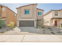 Inviting two-story home with a modern design and a neatly paved driveway at 6148 Vista Teal Ln, Las Vegas, NV 89115