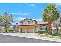 Charming home featuring an attached garage, well-maintained landscaping and mature trees at 690 Ambling Gait Ave, Henderson, NV 89015
