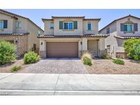 Charming two-story home with a two-car garage and low-maintenance landscaping at 835 Aurelie Ridge St, Henderson, NV 89011