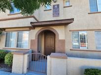 Charming multi-Gathering home with arched entryway and decorative gate at 10231 Deerfield Beach Ave # 104, Las Vegas, NV 89129