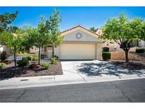 Charming single-story home with a well-manicured yard and a two-car garage at 10305 Snyder Ave, Las Vegas, NV 89134