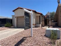 Charming single-story home with a terracotta tile roof and desert landscaping for easy maintenance at 2362 Sierra Sunrise St, Las Vegas, NV 89156