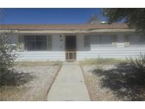 Charming single-story home featuring a well-lit front entrance and a quaint, inviting walkway at 4329 Studio St, Las Vegas, NV 89115