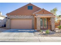 Charming single-story home featuring a two-car garage and a cozy front porch at 437 Via Stretto Ave, Henderson, NV 89011