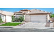 Charming single-story home featuring a two-car garage, well-maintained lawn, and neatly trimmed landscaping at 4529 Gracemont Ave, Las Vegas, NV 89139