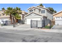Two-story home featuring a gated front yard and a two-car garage at 5264 Silverheart Ave, Las Vegas, NV 89142