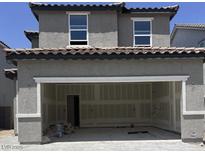 An attached two-car garage offering convenient parking and storage solutions with unfinished drywall at 7341 Daly Grove St, Las Vegas, NV 89113