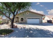 Charming single-story home with a well-maintained front yard and attached two-car garage at 800 Antonio Dr, Las Vegas, NV 89107