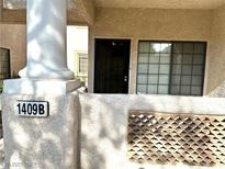 Inviting front entryway with security door and a welcoming column, leading into a cozy residence at 1409 Santa Margarita St # B, Las Vegas, NV 89146