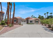 Charming single-story home features a well-manicured yard, desert landscaping, and a spacious driveway at 2102 Rhonda Ter, Henderson, NV 89074