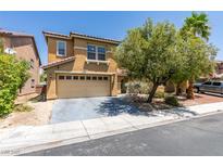 Charming two-story home with a two car garage and manicured front yard landscaping at 212 Stagecoach Flats, Las Vegas, NV 89031