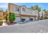 Condominium building exterior shows multi-car garages with low-maintenance desert landscaping at 5155 W Tropicana Ave # 2017, Las Vegas, NV 89103
