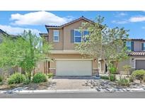 Charming two-story home featuring a tile roof, a two-car garage and a low maintenance landscaped front yard at 8011 Cavazzo Ave, Las Vegas, NV 89178