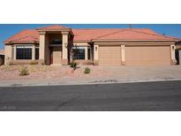 Charming single story home featuring desert landscaping, a terracotta roof, and a spacious two car garage at 904 Swift Bear St, Henderson, NV 89002