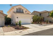 Charming two-story home with a well-maintained front yard, two car garage and mature landscaping at 9105 Chenin Ave, Las Vegas, NV 89129