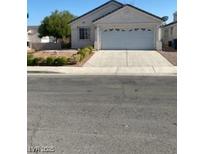 Charming single-story home with a two car garage and well-maintained landscaping in a suburban neighborhood at 9225 Lady Palm Ct, Las Vegas, NV 89147