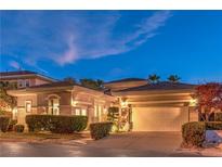 Charming single-story home with a tile roof, an attached two-car garage, and manicured landscaping at 9733 Plateau Heights Pl, Las Vegas, NV 89144