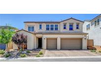 Charming two-story home with a brick driveway and a 2-car garage at 10161 Bismarck Palms Ave, Las Vegas, NV 89166