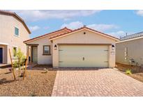 Charming single-story home with a two-car garage and low-maintenance desert landscaping at 2618 Lily Point St, Las Vegas, NV 89156