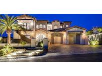 Elegant two-story home boasting a stone facade, tiled roof, and a three-car garage at 30 Via Tiberius Way, Henderson, NV 89011