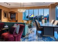 Elegant living room boasts floor-to-ceiling windows offering stunning city views and stylish decor at 360 E Desert Inn Rd # 407, Las Vegas, NV 89109