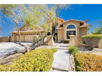 Charming single-Gathering home featuring a well-manicured front yard and a spacious three-car garage at 4620 N Tee Pee Ln, Las Vegas, NV 89129
