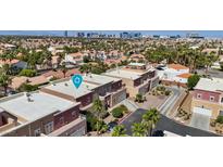Beautiful aerial view of a residential community with townhouses and mature landscaping near Las Vegas at 5603 Deer Creek Falls Ct, Las Vegas, NV 89118