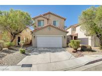 Charming two-story home featuring a two-car garage, tile roof, and low maintenance landscaping at 6264 Canebrake Ct, Las Vegas, NV 89141