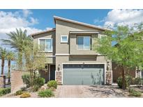 Charming two-story home with landscaped yard, stone accents, and a two car garage at 9238 Bluemist Falls St, Las Vegas, NV 89123