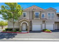 Charming townhome with well-maintained landscaping, attached garage and inviting front entryway at 9975 Peace Way # 2009, Las Vegas, NV 89147