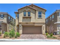 Charming two-story home with a paver driveway, a two-car garage, and a well-maintained front yard at 3164 Bormida Ave, Henderson, NV 89044