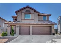 Inviting two-story home boasts a tile roof and spacious two-car garage at 3937 Country Lights St, Las Vegas, NV 89129