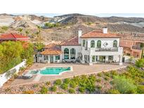 Stunning home features a luxurious pool, spa, and a large patio perfect for outdoor entertaining at 4 Via Vittorio Pl, Henderson, NV 89011