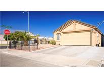 Charming single-story home featuring a spacious driveway and landscaped front yard at 4314 Flaming Ridge Trl, Las Vegas, NV 89147