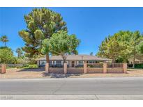 Charming single-story home with desert landscaping and a welcoming covered porch, exuding curb appeal at 5755 W Meranto Ave, Las Vegas, NV 89139