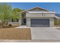 Attractive single-Gathering home featuring a two-car garage and well-maintained landscaping at 6815 Garden Grove Ave, Las Vegas, NV 89103