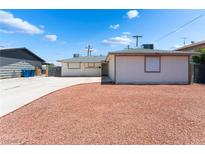 Charming single-story home featuring a well-maintained front yard with tasteful desert landscaping at 704 N Wallace Dr, Las Vegas, NV 89107