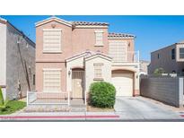 Inviting two-story home with a well-maintained front yard and a charming covered porch entrance at 10414 Midseason Mist St, Las Vegas, NV 89183