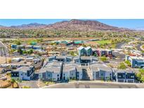 Contemporary townhomes in a vibrant community with mountain views and convenient access to local amenities at 145 Aqua Commons Ln, Henderson, NV 89015