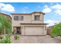 Charming two-story home with a brick driveway and manicured landscaping at 1631 Desert Path Ave, North Las Vegas, NV 89032