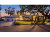 Inviting single-story home featuring manicured landscaping, a tile roof, and an attached two-car garage at 2935 Montessouri St, Las Vegas, NV 89117