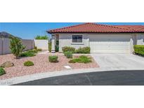 Charming single-story home with a well-manicured front yard and a two-car garage at 454 Intrepid Ct, Boulder City, NV 89005