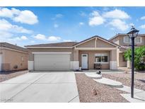 Charming single-story home featuring a two-car garage, neutral palette, and desert landscaping for low maintenance at 5001 Morning Falls Ave, Las Vegas, NV 89131