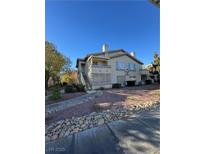 Inviting two-story condo with a charming entrance and well-maintained landscaping at 5710 E Tropicana Ave # 2225, Las Vegas, NV 89122