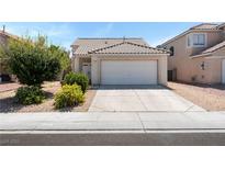 Charming single-story home featuring a two-car garage and low maintenance desert landscaping at 5914 Rose Sage St, North Las Vegas, NV 89031