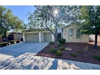 Charming single-story home featuring a three-car garage, a well-maintained yard and mature shade trees at 6614 Collingsworth St, Las Vegas, NV 89131